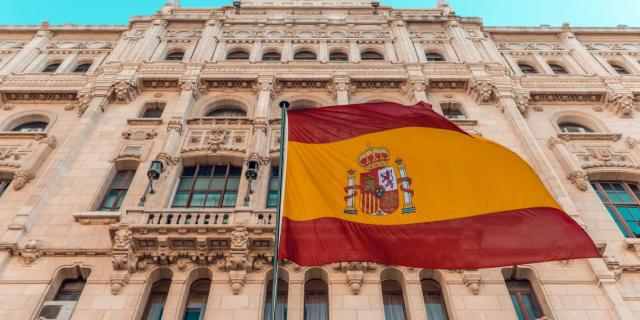 spanish flag in front of a building