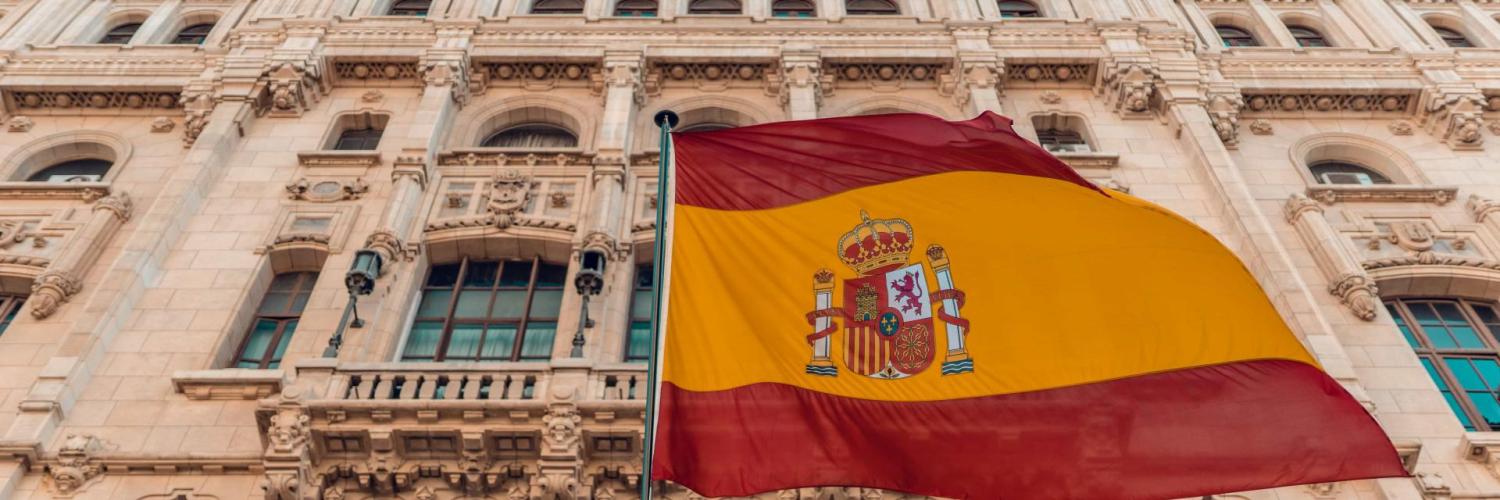 spanish flag in front of a building