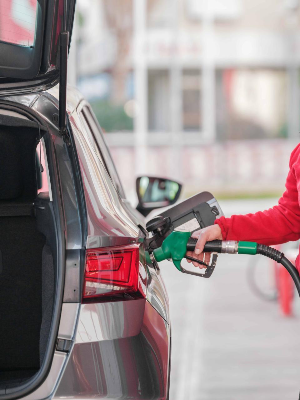 car being filled with gasoline