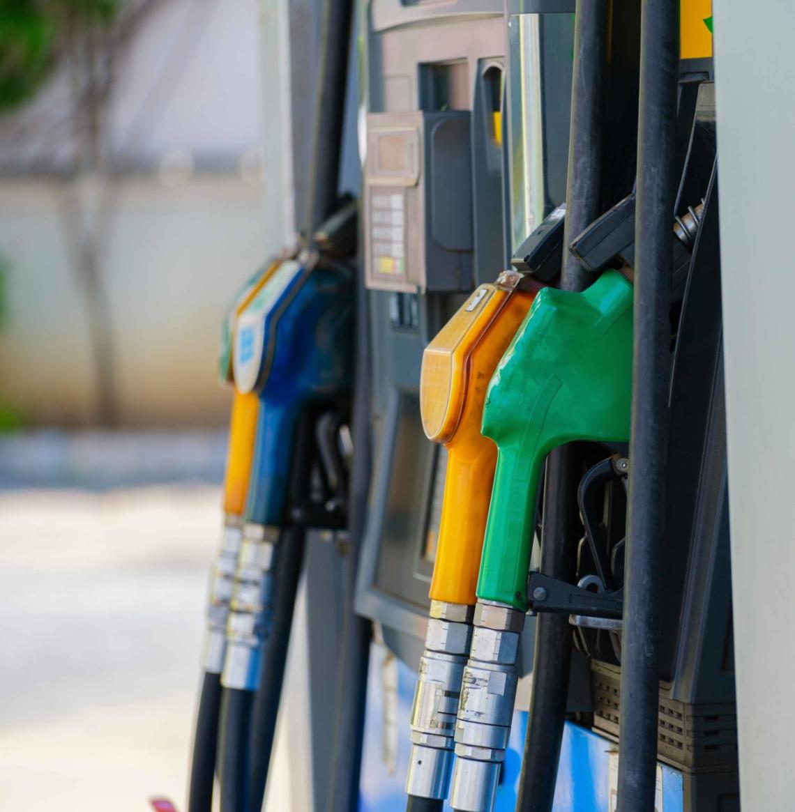 A zoomed in view of pumps at a gas station