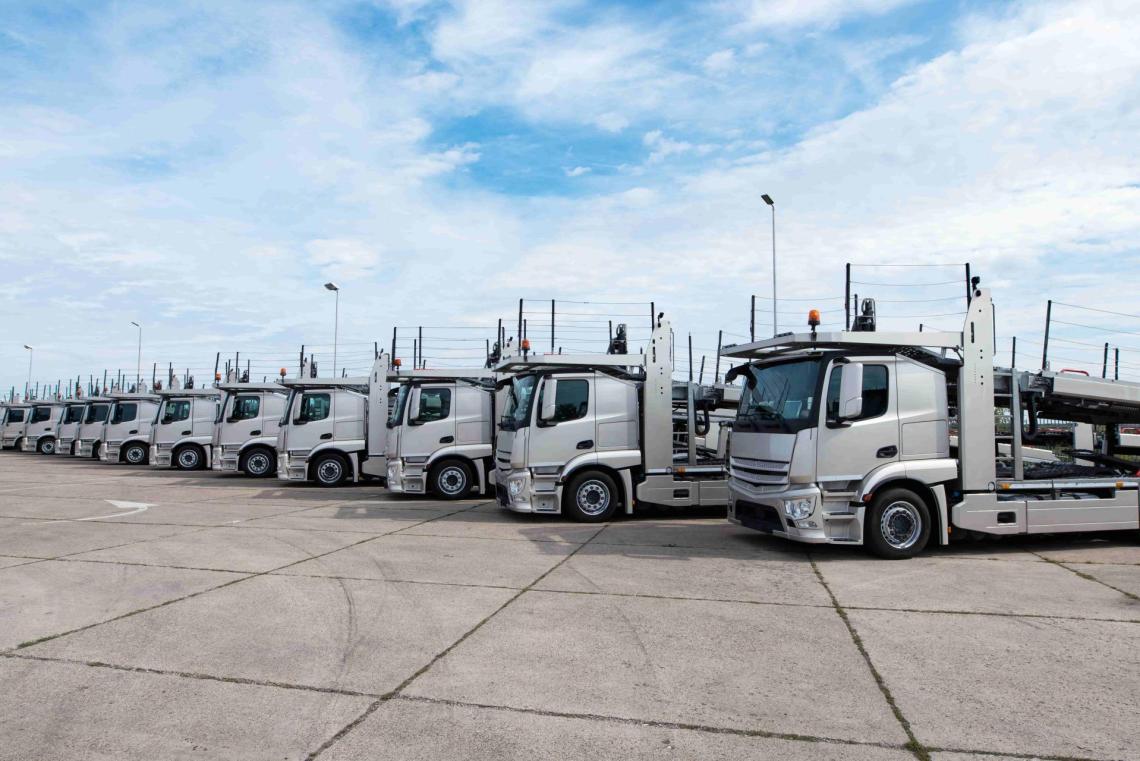 A line of parked transport trucks used to carry multiple vehicle